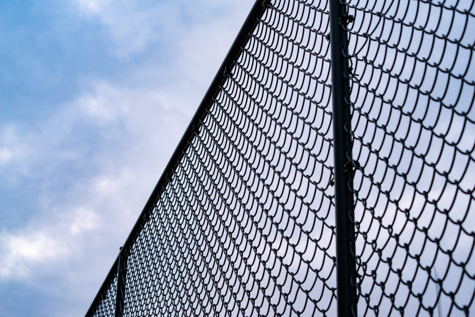 Metal fence under blue sky