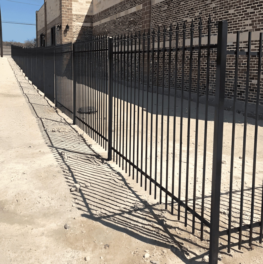 Industrial fence casting long shadows